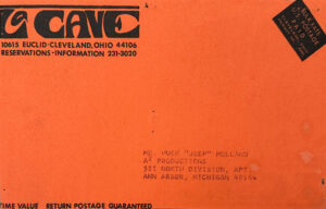The back includes essential venue details, such as La Cave's address (10615 Euclid Avenue, Cleveland, OH), phone number, and reservation instructions.